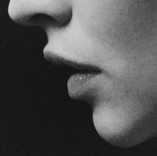 A woman with glp-1 face contemplates if glp-1 face is real