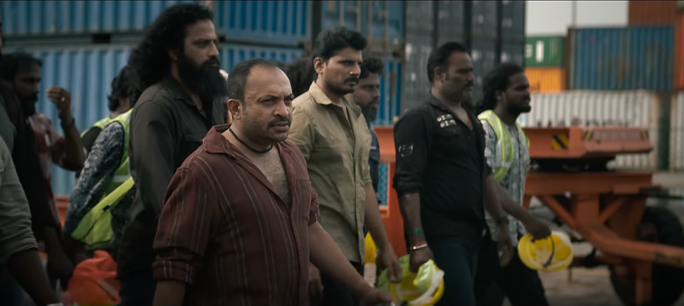 Shobhin in red shirt in coolie