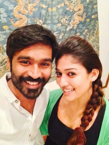 Dhanush in white shirt and Nayanthara in a black top and aqua green crop jacket