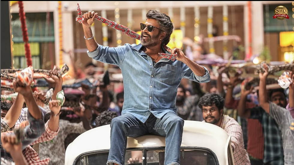 Rajini in Denim shirt sitting on top of an ambassador car for chikitu song.