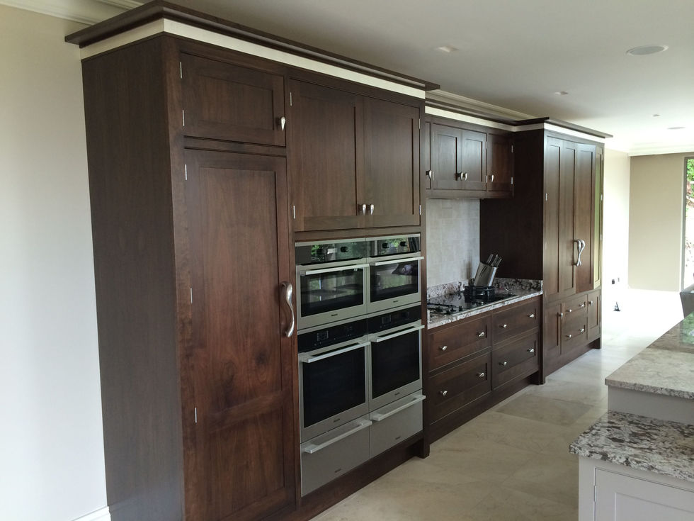Silver leaf cornice detail on a black walnut kitchen