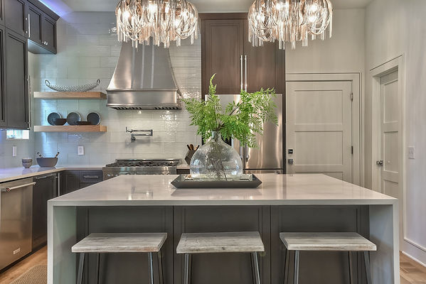 Kitchen with black countertops and white granite island