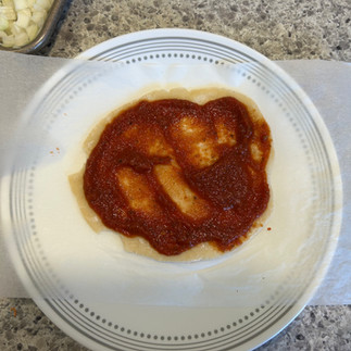 Sauce spreads nicely on the par-baked crust