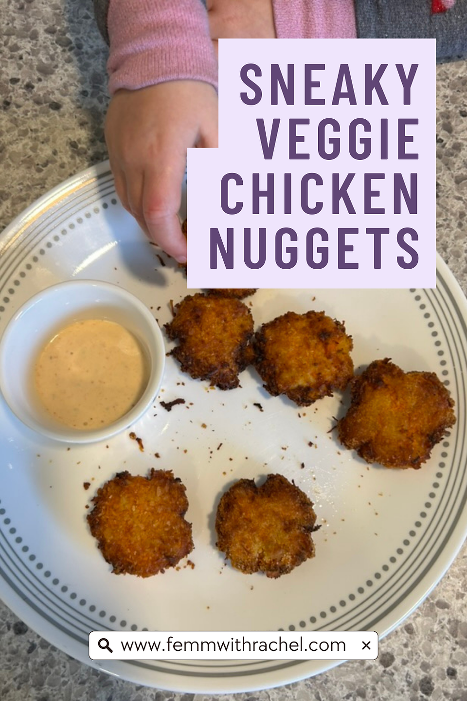 child's hand reaching for nugget