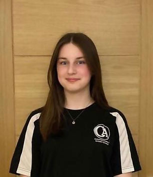 girl with long hair wearing a black t shirt