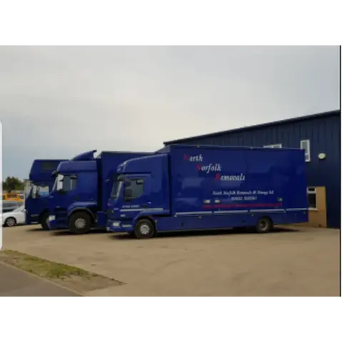 removal vans parked next to each other