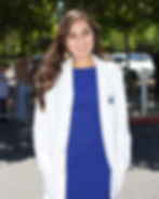 Female dental student in her dental white coat