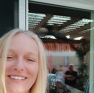 Me on The Back Porch taking a selfie with Brian in the reflected patio door glass