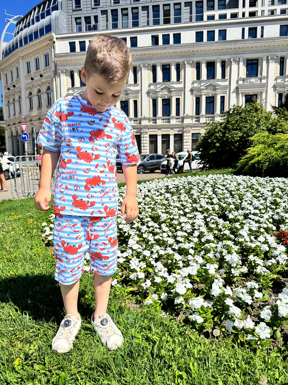 Thumbnail: Toddler standing in a garden wearing Crabby Days Set, front view