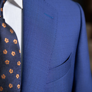 The navy color of the Suit is a classic, luxurious tone.