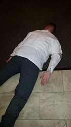 victim laying on the floor