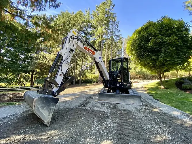 Excavator performing site excavation work in lower mainland