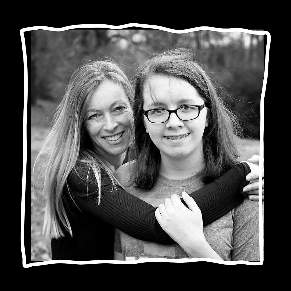 Black and white photo of two women smiling and hugging