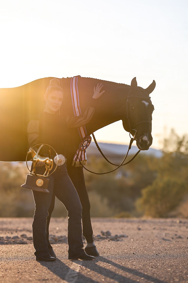 Madison Nirenstein poses with Henry with her World Championship globe. Photos courtsey of Gina Mae Photography. 