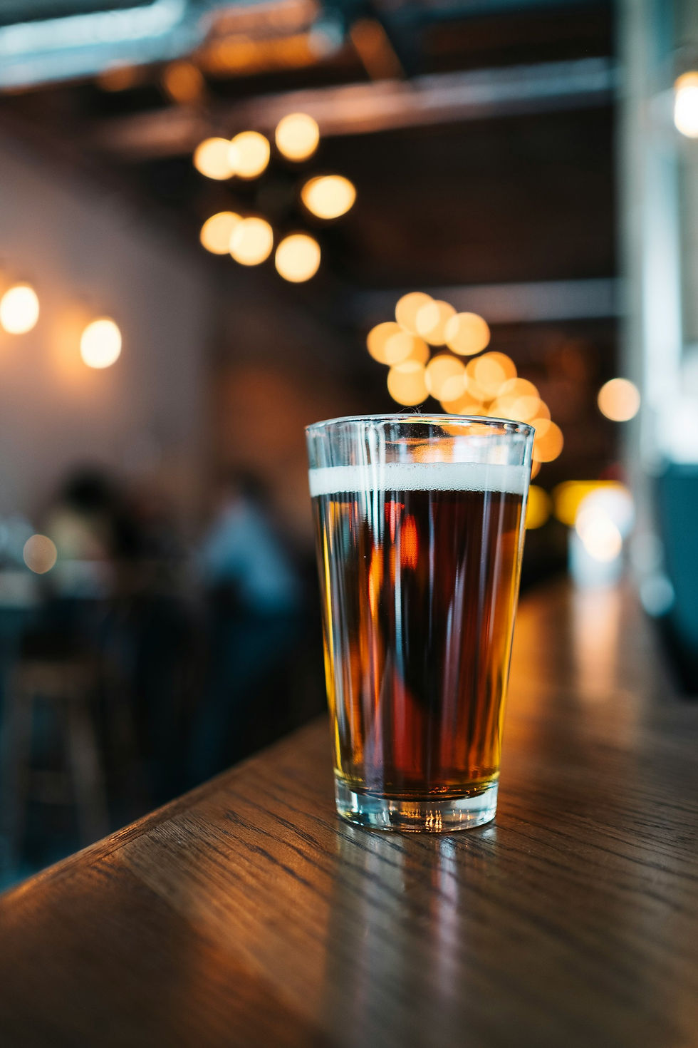 A beer sat on a table in the pub