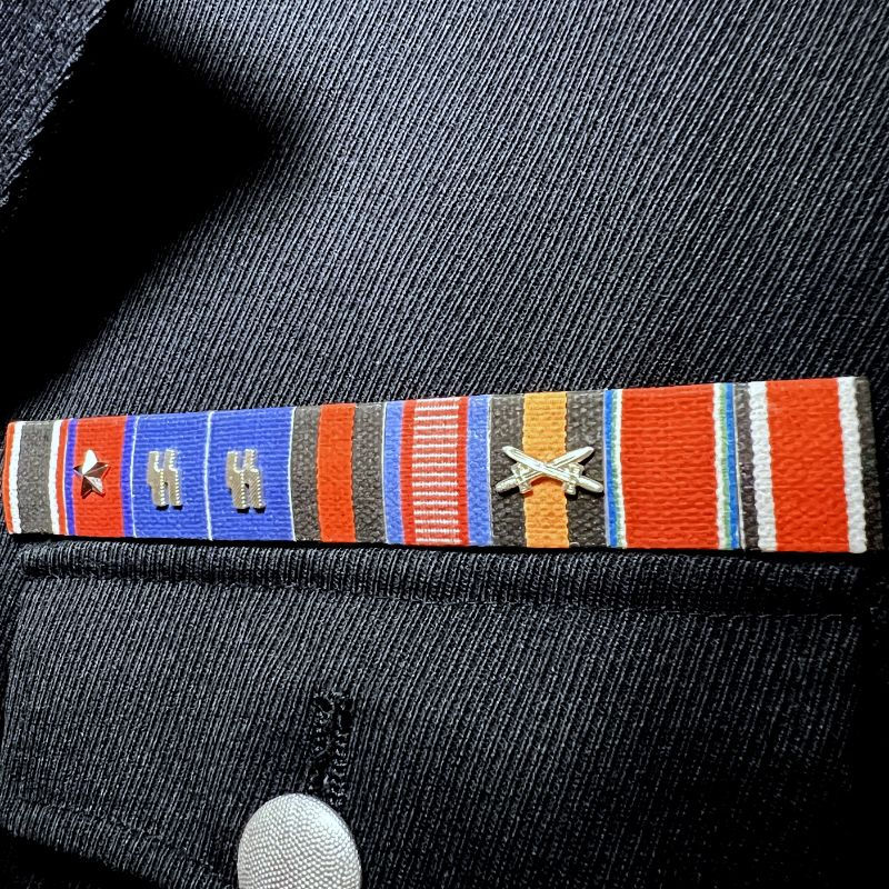 Thumbnail: Medal ribbon bar of SS-Obergruppenführer John Smith from "The Man in the High Castle" on M32 tunic. Reproduction for sale.