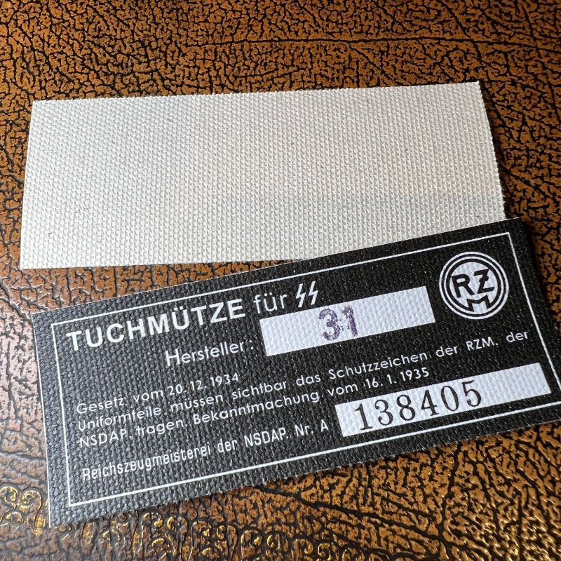Thumbnail: Black SS Tuchmütze (Visor Cap) RZM tag from Krause Papierwerke. Stamped version.
