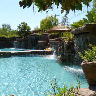 Tropical Custom luxury pool faux rock waterfall Pacific Palisades