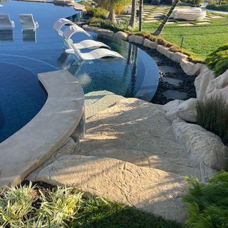 Custom luxury Backyard Environments Pool faux rock Pacific Palisades