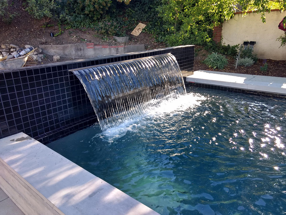 custom water feature in backyard pool Malibu