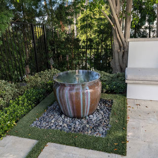 Custom luxury Backyard Environments Pool water fountain in Santa Barbara