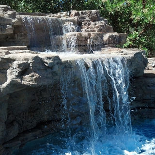 Custom luxury Backyard Environments Pool water fountain in Los Angeles waterfall