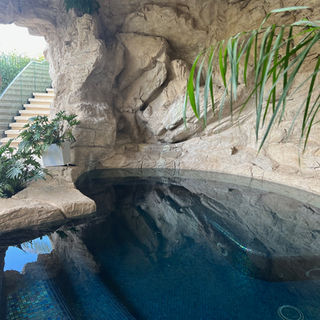 Custom luxury Backyard Environments Pool faux rock Pacific Palisades