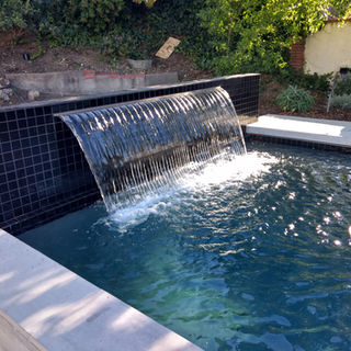 Custom luxury Backyard Environments Pool water fountain in Montecito