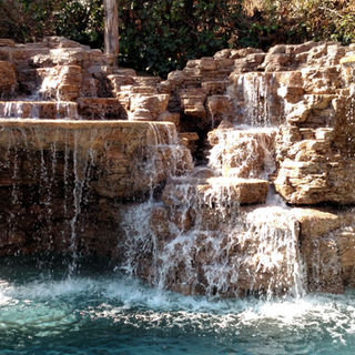 Custom luxury Backyard Environments Pool water fountain in Los Angeles