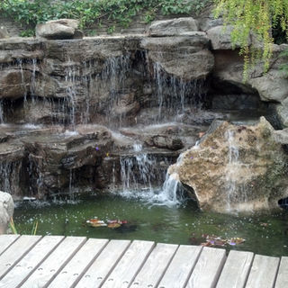 Custom luxury Backyard Environments Pool water fountain in Montecito