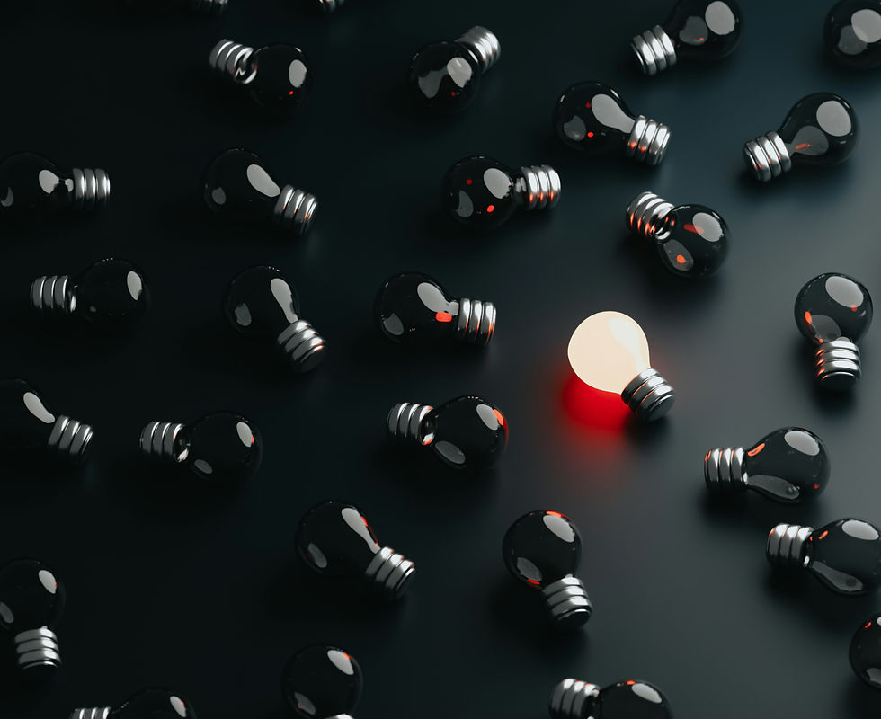 Lightbulbs on the ground but with one lit up