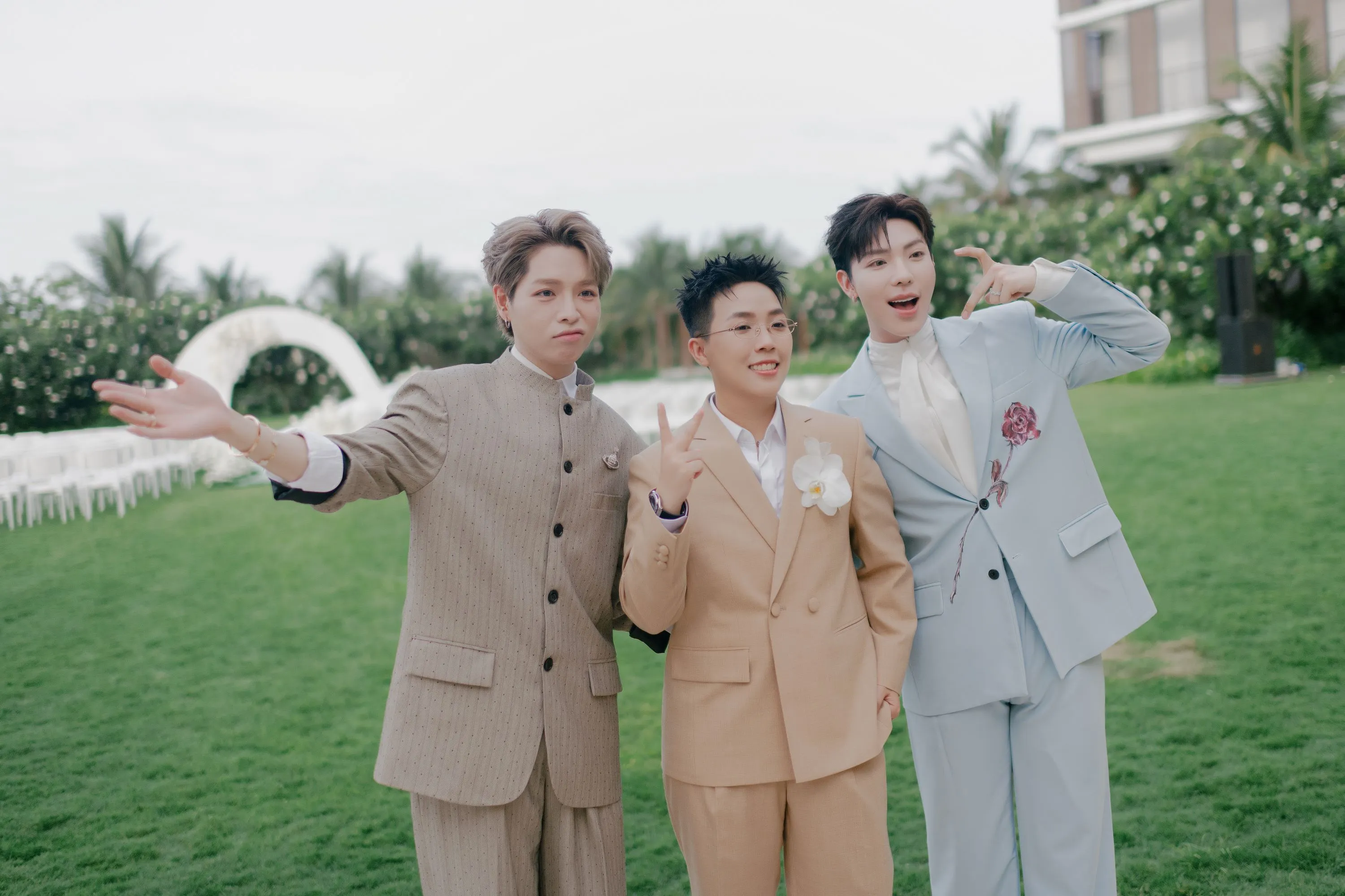 The groom Kai Dinh poses with his closes friends, sharing cheerful and candid expressions after the ceremony.