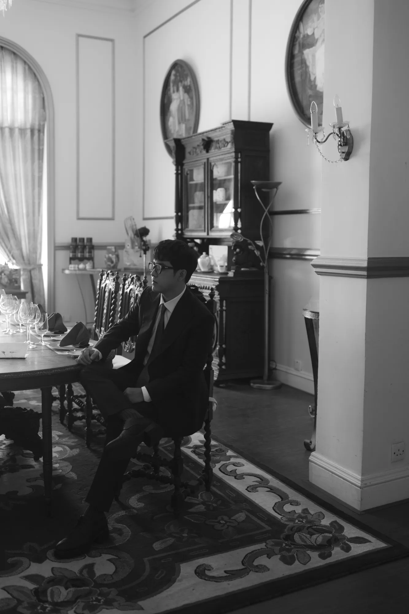 A groom sitting quietly and reflecting before the ceremony.