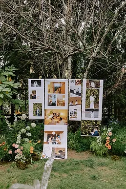 Outdoor photo display showcasing personal memories in a garden wedding setting.