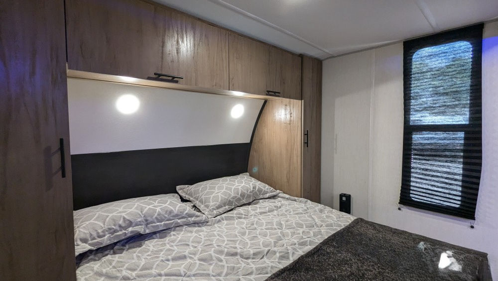 Sugar Wolf bunkhouse travel trailer bedroom – photo 10