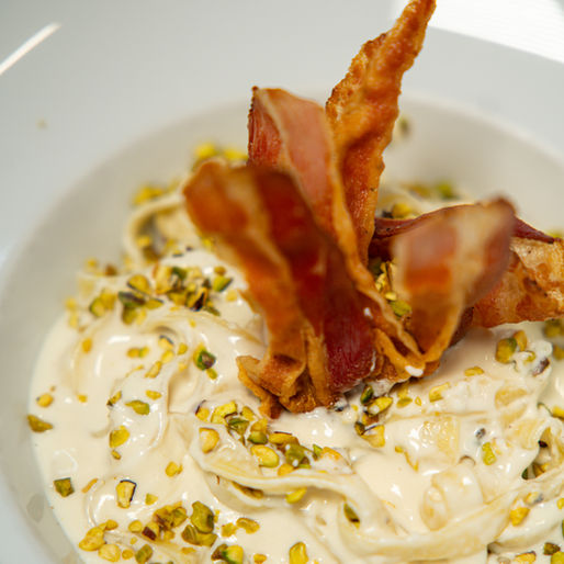 Today we present a much-loved Pasta dish from Osteria Fanal del Codega: Tagliatelle with Brie, crunchy Bacon and Pistachio