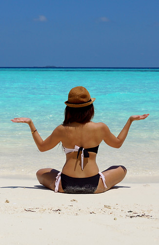 Woman finding balance on beach