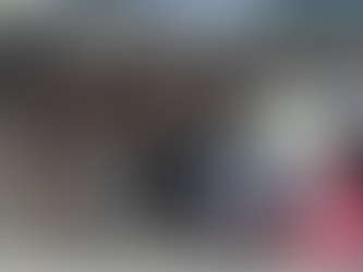 A woman feeds stray dogs at a shelter