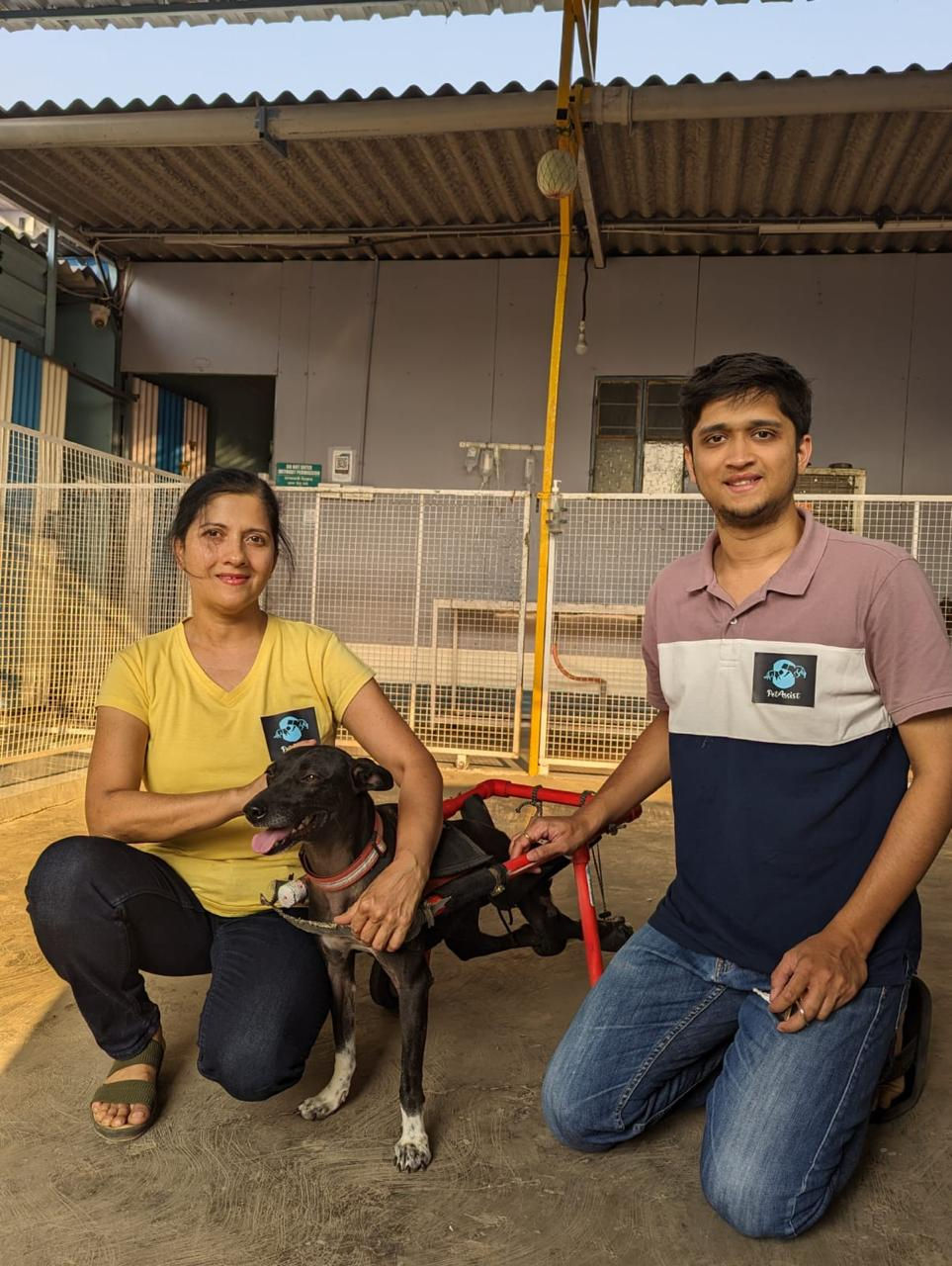 Ajinkya and Asawari with a wheelchair assisted dog.