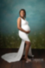Studio maternity portrait white gown