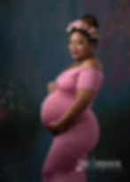 Studio maternity portrait with pink gown