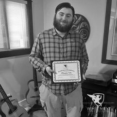 Harrison Vos graduating from the CNC for Guitar Making Course.