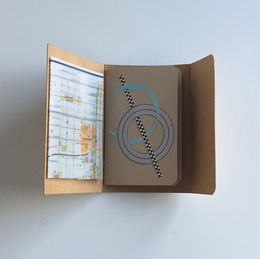 A handmade booklet with a pop out map