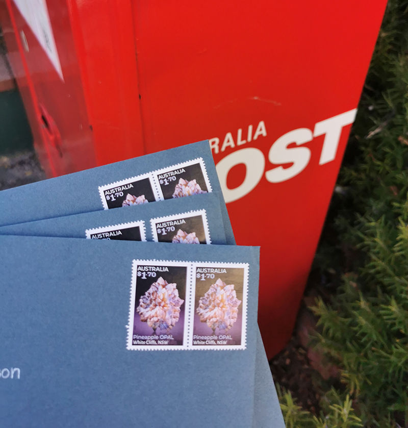 Thumbnail: stamped blue envelopes and red austrlian postbox