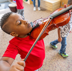 Young boy playing violin