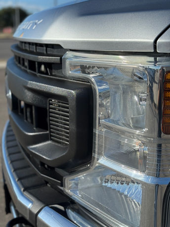 clean truck grill and headlight truck detail
