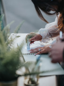 Group of guests creating fun memories in a luxury photo booth at a countryside wedding in East Anglia.