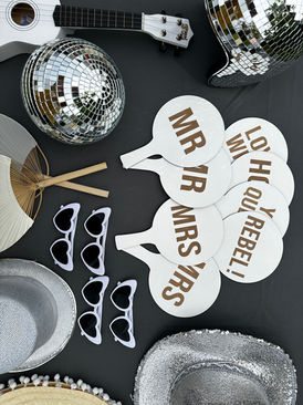 Wedding guests laughing and posing inside a luxury indoor photo booth supplied by The Photo Booth Company in East Anglia.
