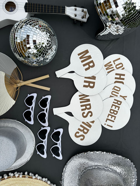 Wedding guests laughing and posing inside a luxury indoor photo booth supplied by The Photo Booth Company in East Anglia.