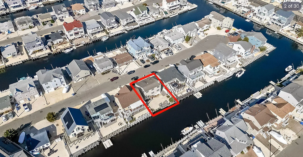 Aerial view of sold properties in a canal neighborhood.